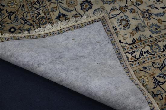 A Tabriz cream ground carpet, 12ft 6in. by 9ft 9in.